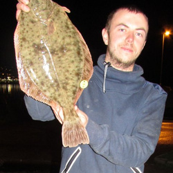 Steve King with a shore caught Flounder - 3lb 2oz 4dr (17th January 2015)